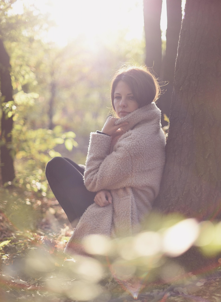 Woman against a tree